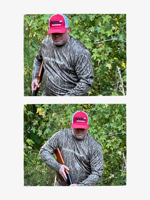 Red Bobber x Mossy Oak UPF 50 camouflage fishing shirt modeled outdoors, showing the long-sleeve performance fit